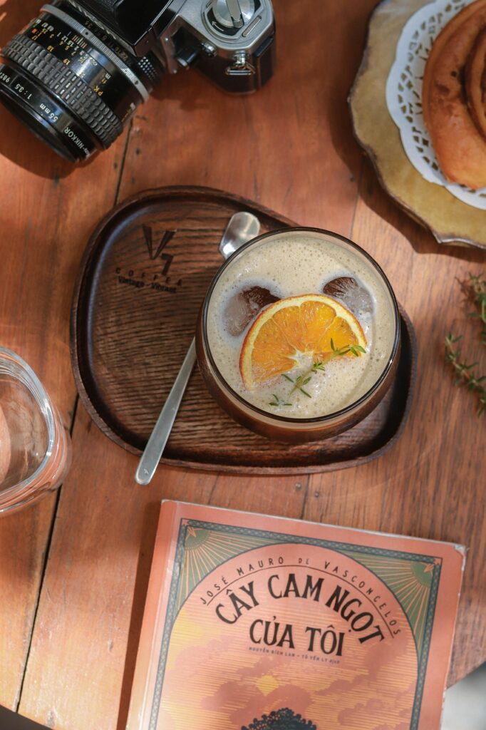 Home drink, book, orange, food stylist, flat lay, food, camera