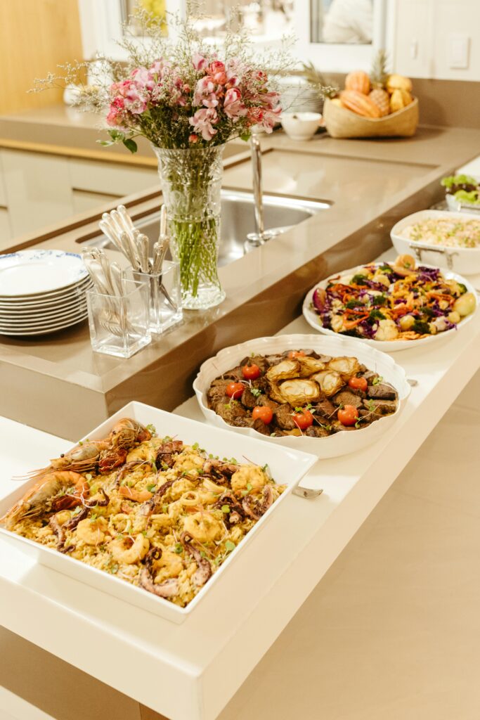 Luxurious buffet arrangement with diverse dishes in a stylish kitchen setting.