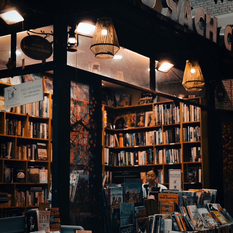 A warm, inviting view of a bookstore in Vietnam during the evening.
